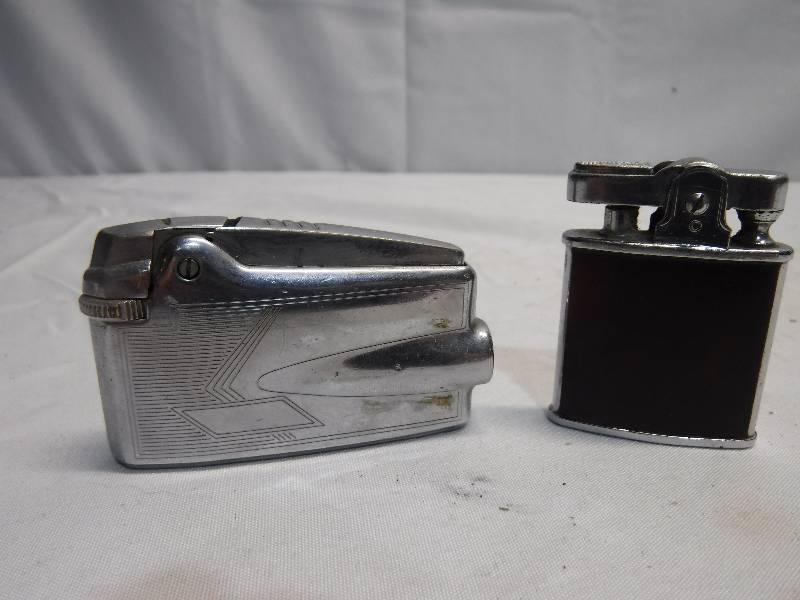 lot 1238 image: 2 refillable lighters, one is a unique shape