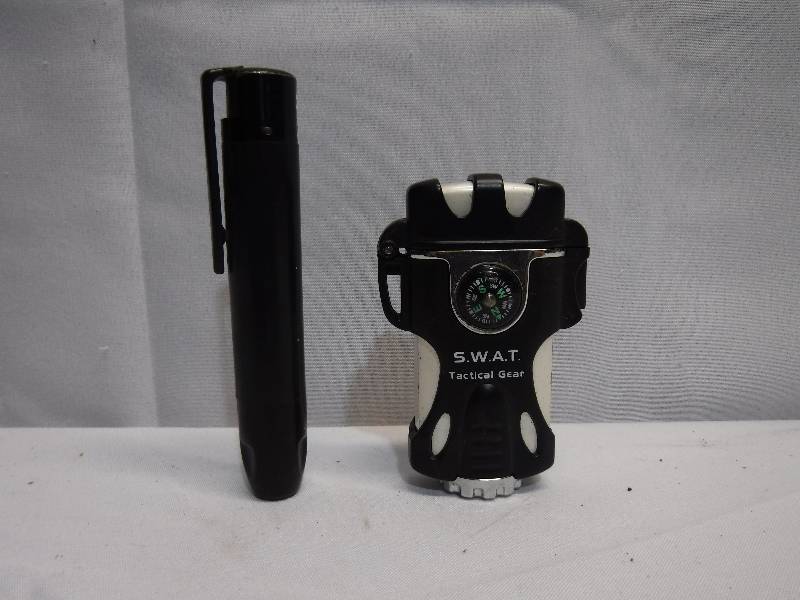 lot 1240 image: pen style lighter and SWAT lighter
