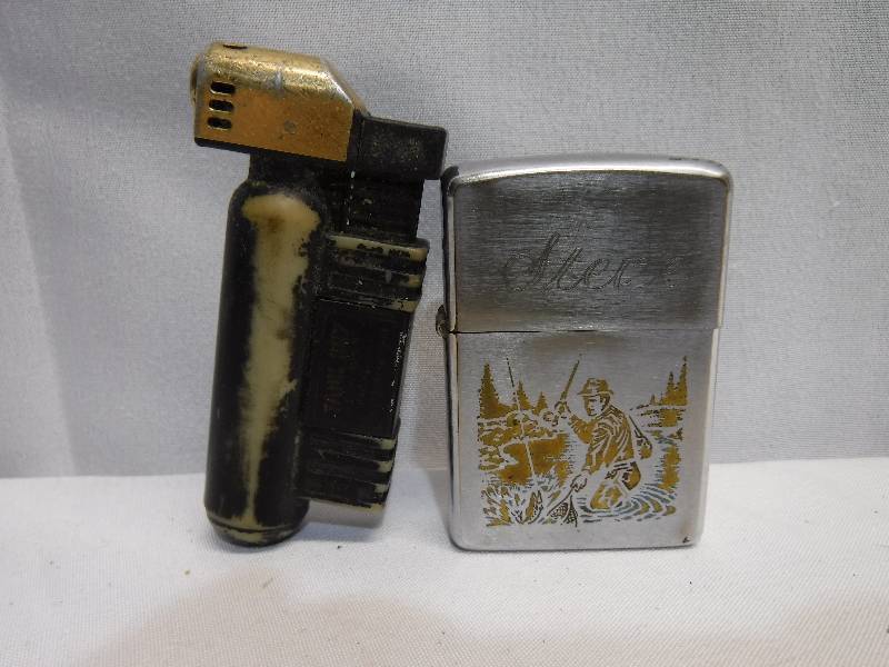 lot 1242 image: 2 lighters, one has a fisherman on it