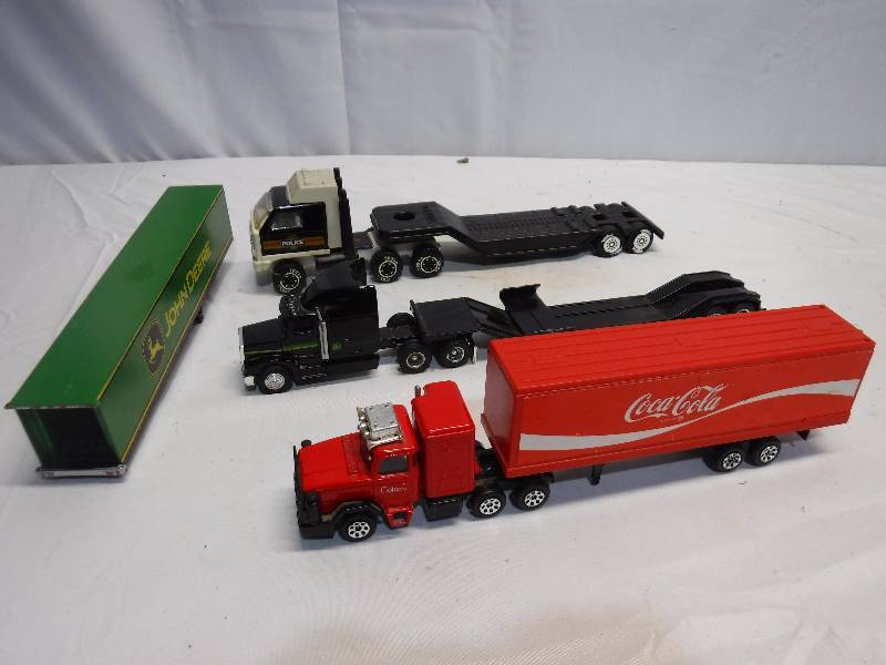 lot 1290 image: Coca Cola toy semi, John Deere Toy semi and more