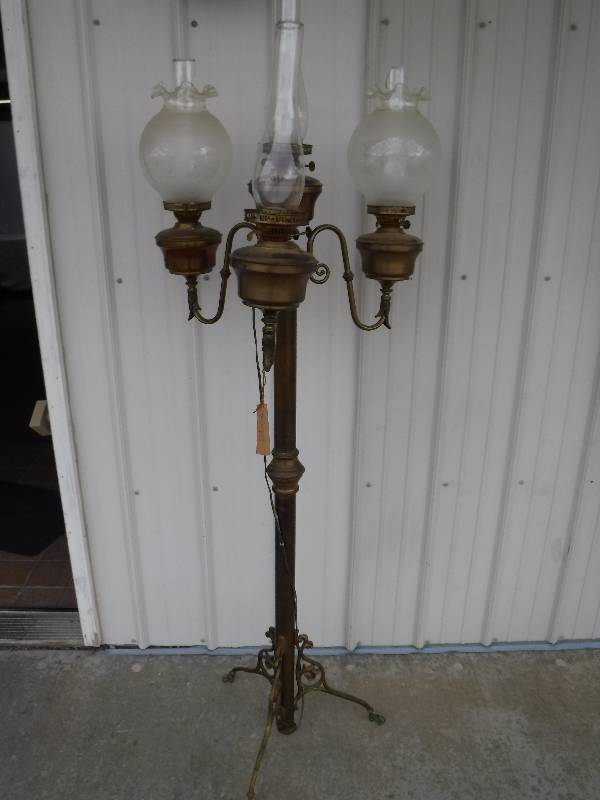lot 1311 image: Vintage oil lamps turned into a floor lamp. Very cool