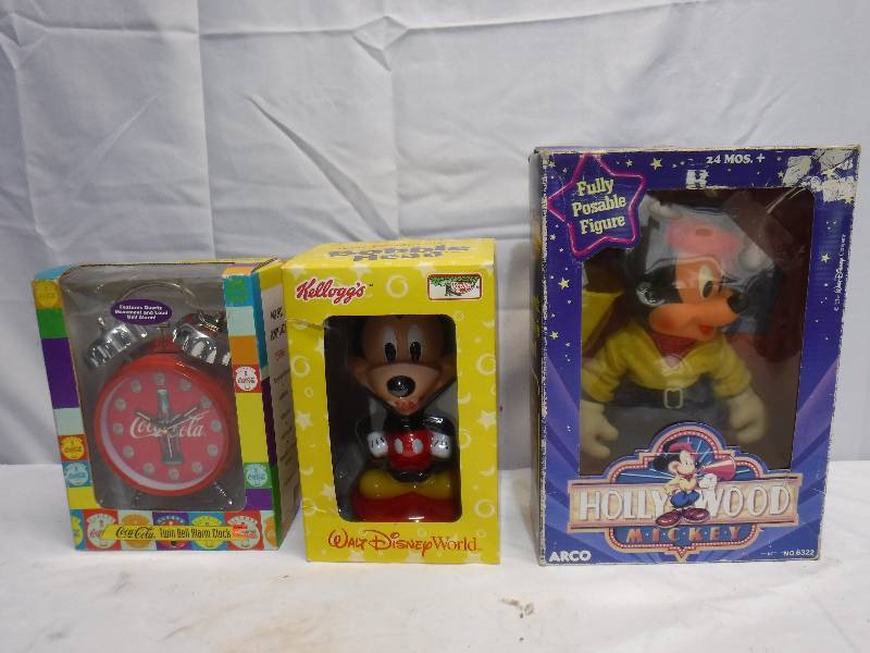 lot 1337 image: Mickey mouse bobble head and posable figure as well as a coca cola alarm clock