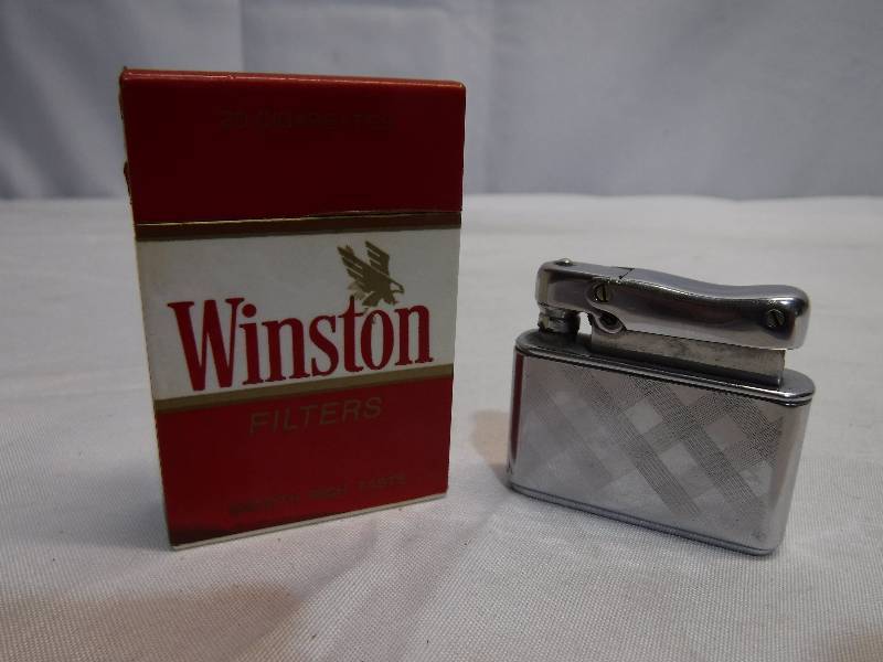 lot 1398 image: Winston brand lighter and other lighter