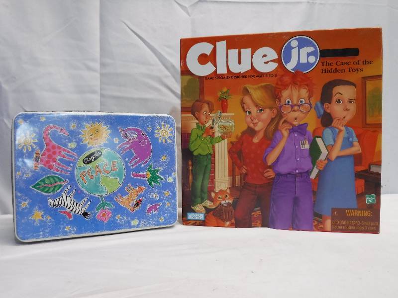 lot 1410 image: Clue jr and tin with cookie cutters in it