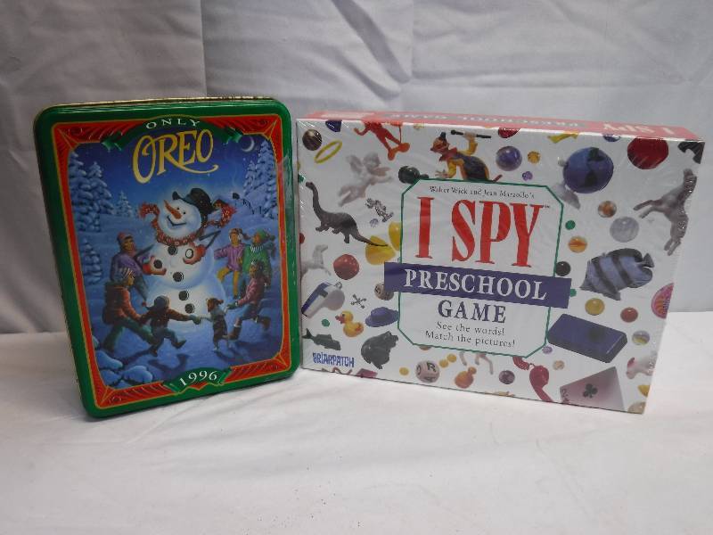 lot 1412 image: I spy Preschool game and tin with paints in it
