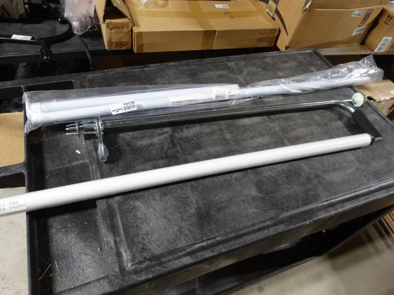 lot 19159 image: Tension rod, office wall paper, and weed puller