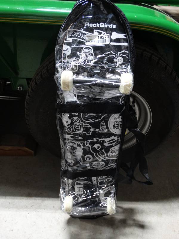 lot 19270 image: Skateboard with carry bag.