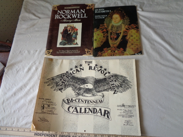 lot 6544 image: Queen Elizabeth Paper Dolls to Color book, Norman Rockwell Memory Album and The American Revolution Bi-Centennial Calendar