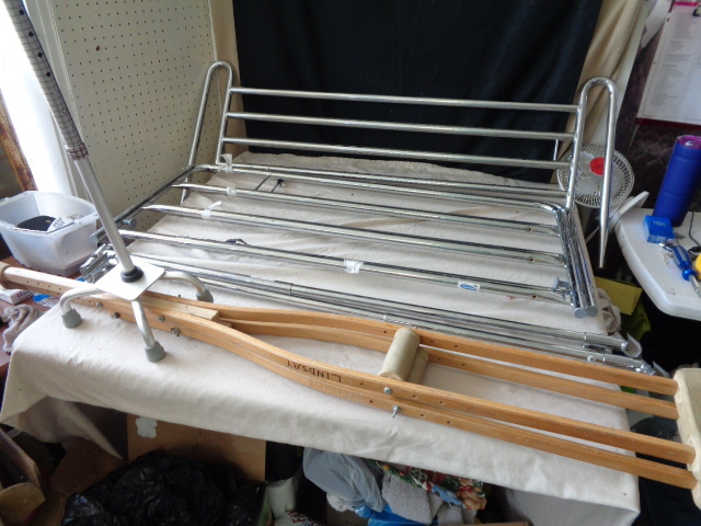lot 6645 image: Bed Rails for Hospital Bed, Set of crutches, and Walking Cane