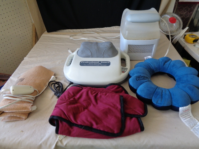 lot 6676 image: Heating pad, Professional Touch Massager, Pro Care Humidifier, Total Pillow and Weighted Vest ALL WORK
