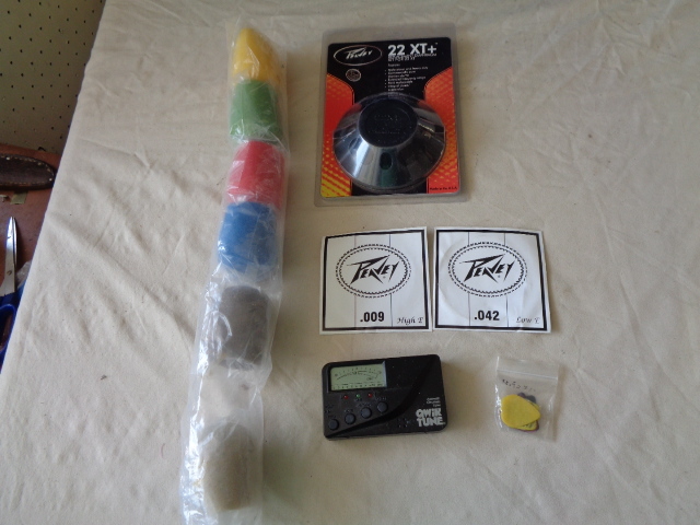 lot 6705 image: Automatic Chromatic Tuner, 22XT Repalcement Diaphgram, Guitar Picks, .009 and .042 Guitar Strings and Microphone Covers