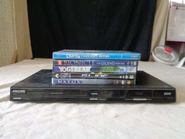 lot 6748 image: Philips DVD Player and 5 DVDs