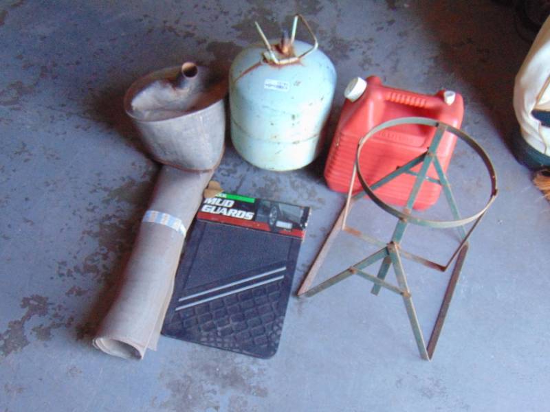 lot 10785 image: Truck Mud Flaps, Bottle of Refrigerant, gas can and more
