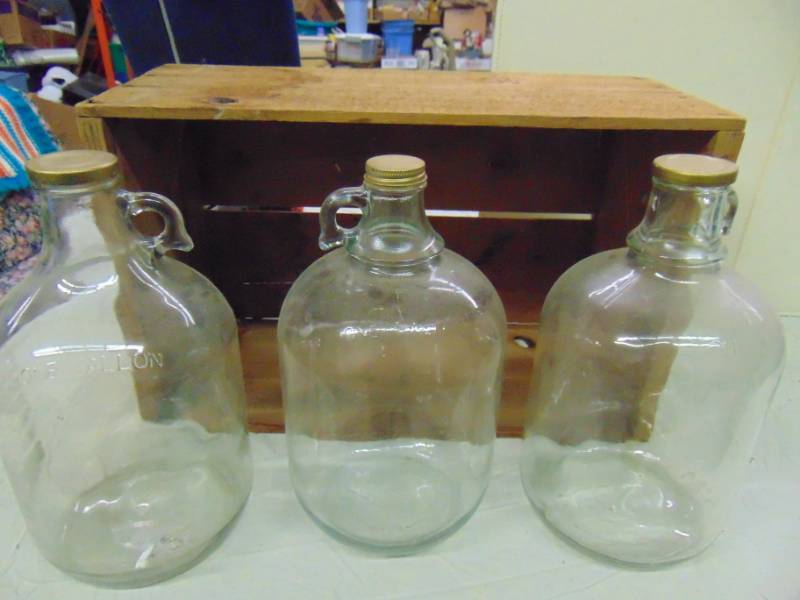 lot 10845 image: Vintage Wooden Crate and 3 One Gallon Jugs with lids