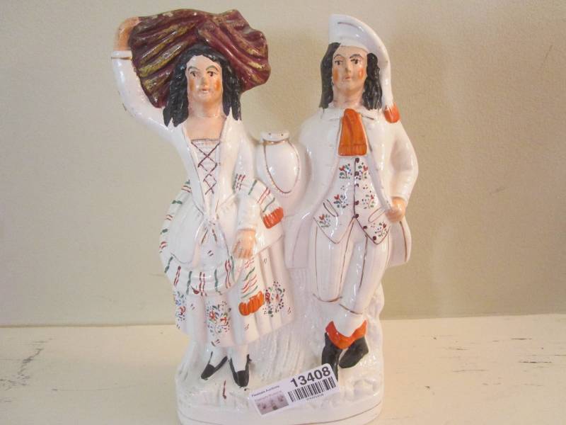 lot 134080 image: Man and Lady Statue