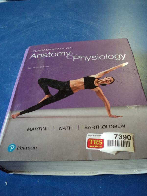 lot 7390 image: Fundamentals of Anatomy & Physiology Pearson II Edition Textbook, damage pictured