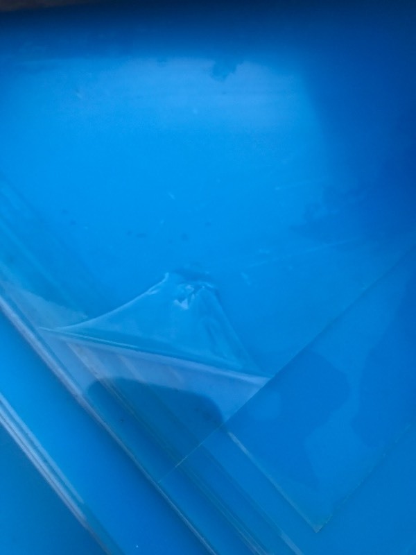 lot 77 image: (5) 4 x 8 sheets of thin clear plastic with protective coating on each side  rolled up for easy transport great for framing in screened porch panels use your imagination
