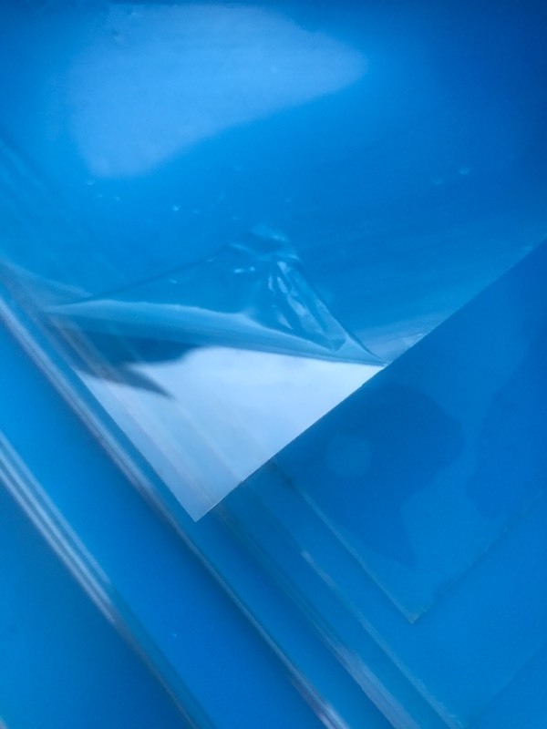 lot 79 image: (5) 4 x 8 sheets of thin clear plastic with protective coating on each side  rolled up for easy transport great for framing in screened porch panels use your imagination