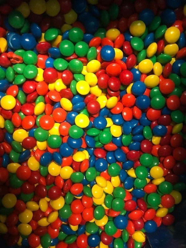 lot 9366 image: Bulk box of candy covered chocolate same style as M&Ms  25 pound box