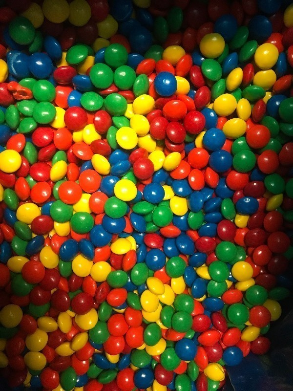 lot 9369 image: Bulk box of candy covered chocolate same style as M&Ms  25 pound box