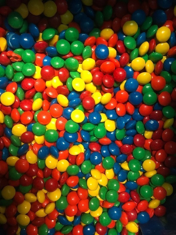 lot 9370 image: Bulk box of candy covered chocolate same style as M&Ms  25 pound box