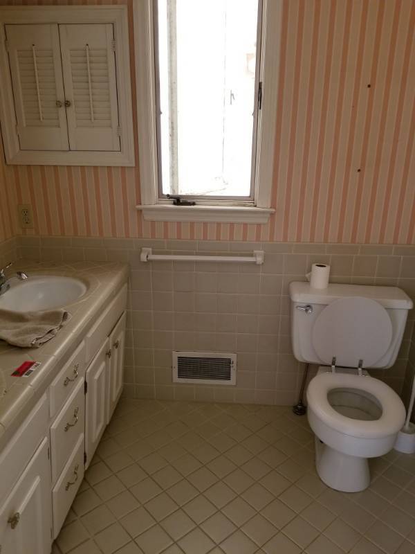 lot 1668 image: Double Sink Vanity, Shower, Toilet, Door and Window