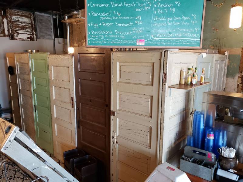 lot 38 image: Custom wall made from Vintage Doors