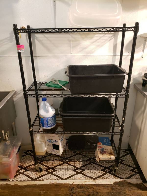 lot 53 image: Black Metal Rack on Wheels with contents.