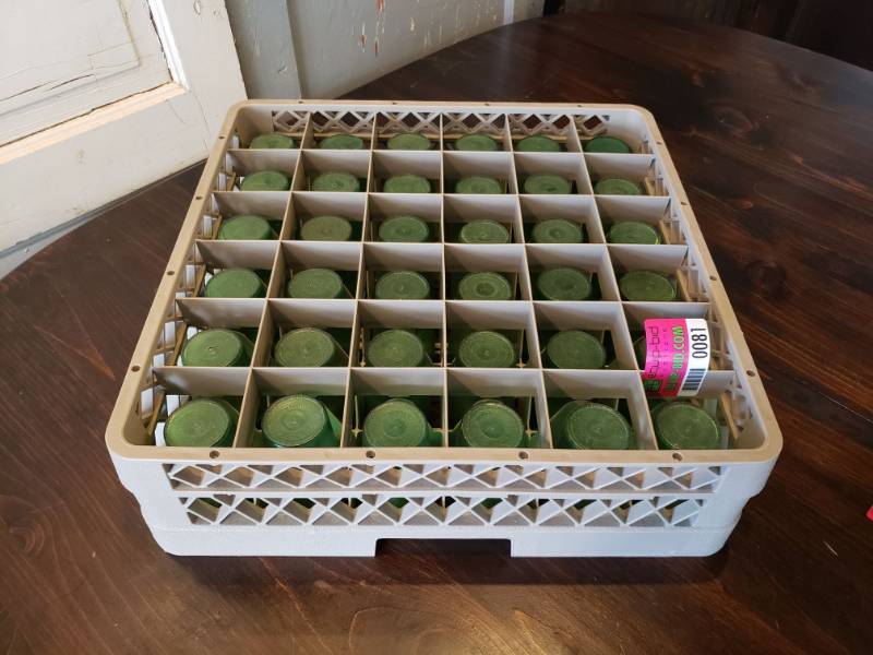 lot 81 image: (36) Small Green Plastic Cups with case.