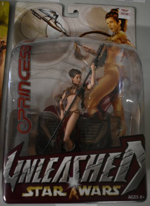 lot 1181 image: New In Package Hasbro Star Wars Princess Leia Golden Bikini Unleashed Action Figure