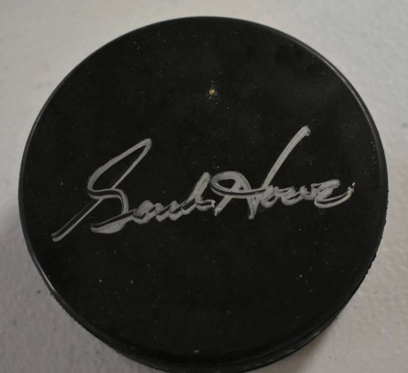 lot 1038 image: Signed Gordie Howe Official NHL Hockey Puck in Silver Ink