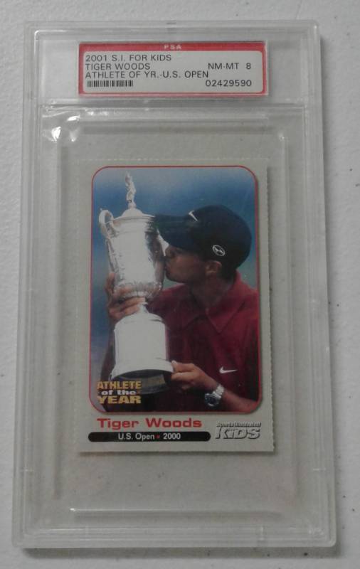 lot 1087 image: Near Mint-Mint PSA 8 2001 Sports Illustrated For Kids Tiger Woods Athlete of the Year - US Open Golf Trading Card