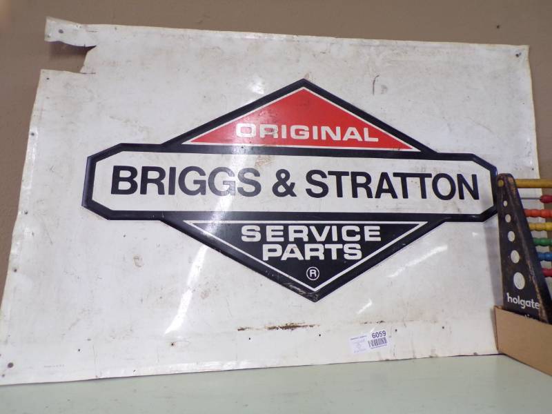 lot 6059 image: BRIGGS AND STRATTON TIN SIGN