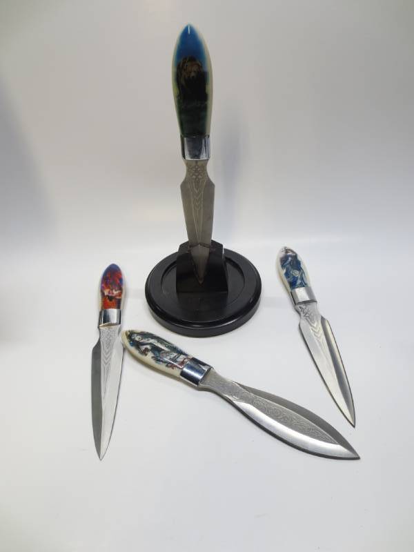 lot 1107 image: Lot of 4 Decorative Stainless Steel throwing knives