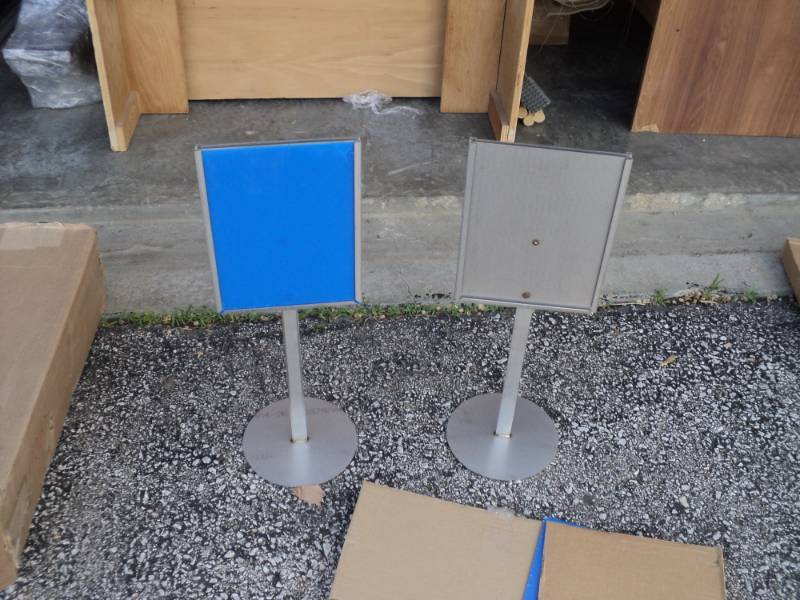 lot 7755 image: (2) Double sided 304 Stainless steel sign holders, approx 8 x 10 signs with plexi-glass panels. 24 tall