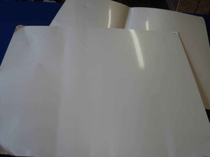 lot 6974 image: (2) pieces metal trim, white, 31 x 25, pieces are bent in a few places, pictured