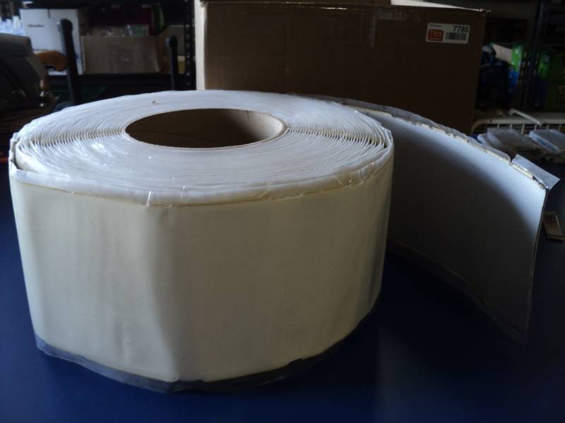 lot 7785 image: (1) roll white trim (possibly reflective) adhesive back 6 x approx 20, PN 0219-2A