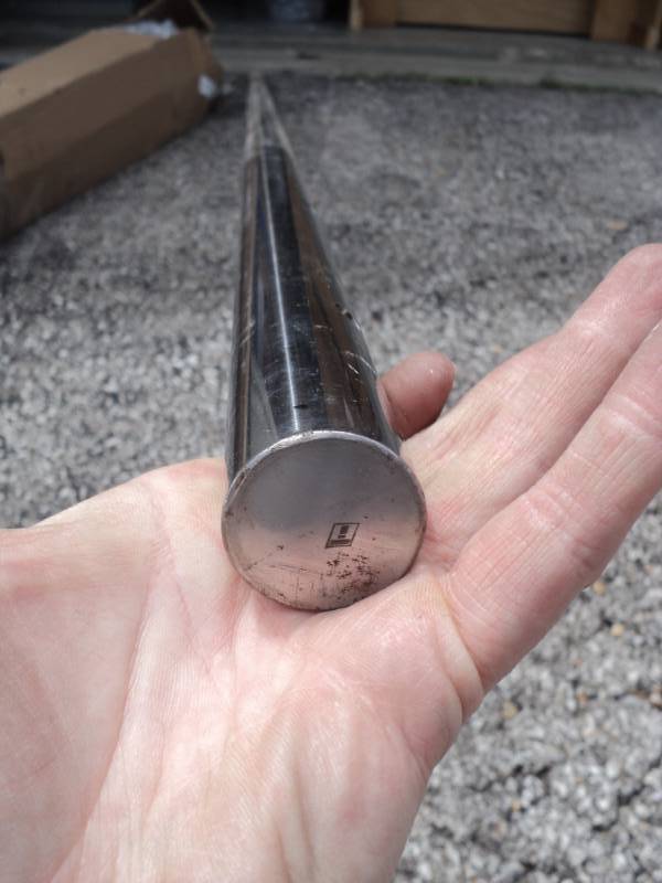 lot 7789 image: (1) piece metal bar stock 1-18 diameter x 8 long, threaded holes every 6