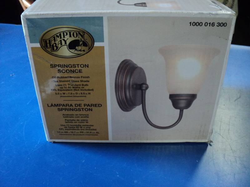 lot 7800 image: (1) Hampton Bay Springston Sconce, Oil rubbed bronze finish, tea stained glass shade, 7.8 x 8.5, uses 60 watt bulb not included
