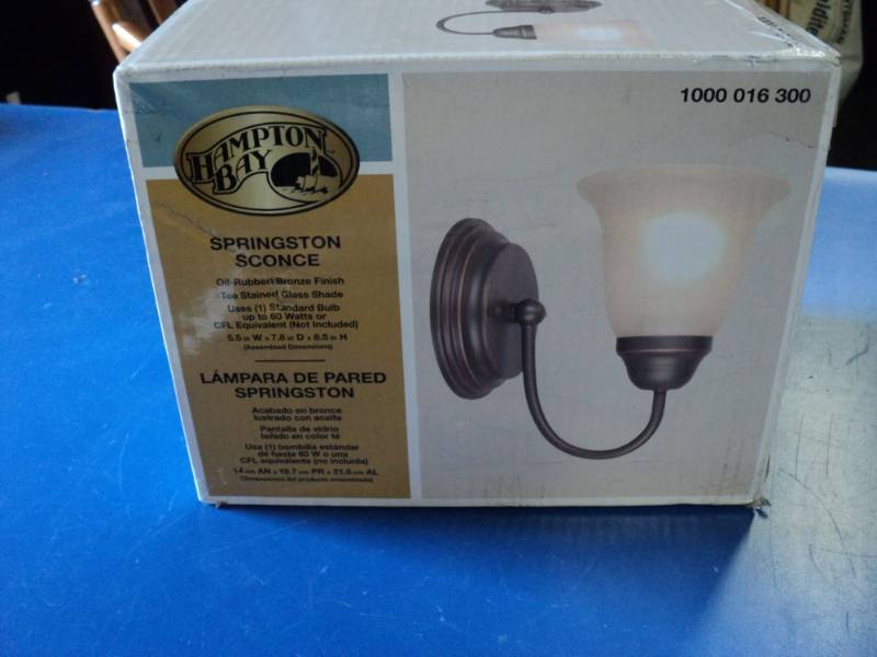 lot 7801 image: (1) Hampton Bay Springston Sconce, Oil rubbed bronze finish, tea stained glass shade, 7.8 x 8.5, uses 60 watt bulb not included