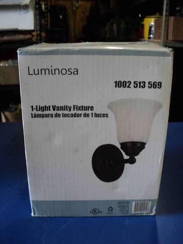 lot 7802 image: (1) Liminosa 1-Light Vanity Fixture PN 1002513 569, Oil rubbed bronze finish, frosted glass shade 6 x 9.25 6.75, uses 60 watt bulb, not included