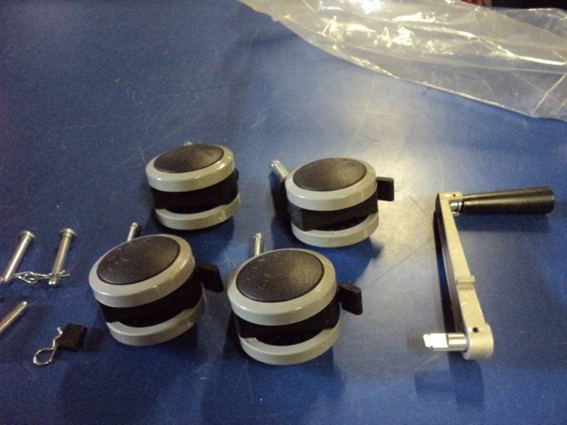 lot 7833 image: (4) ct lot Drive plastic Caster Wheels, Swivel Post mount w pins and crank, 2-78 diameter x 1-78 wide, 12 diameter post x 2 long, brake on one wheel is broken- pictured