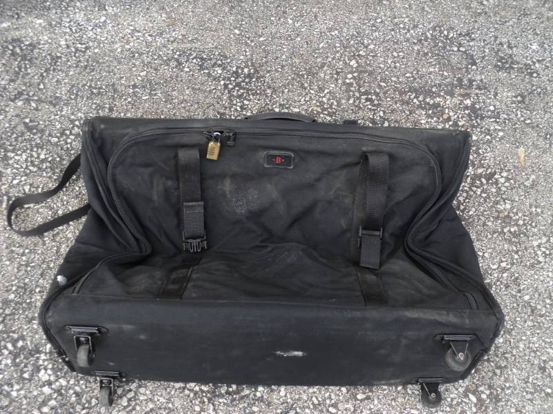 lot 7885 image: Tumi Soft-sided Luggage, collapsible for easy storage, approx 8 x 29 x 18, used