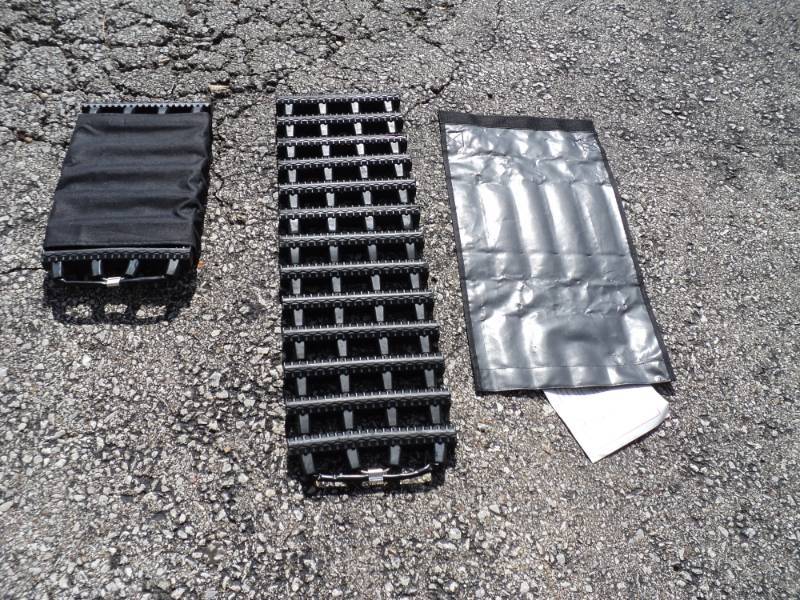 lot 7936 image: (1) pair snow mud sand track, tire traction mats, 29 x 8-23 in carrying wrap for easy storage