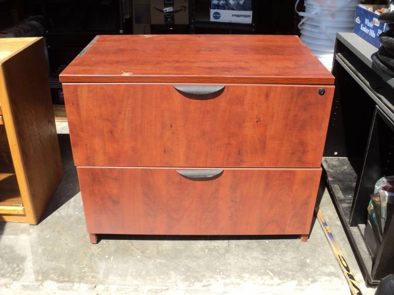 lot 7966 image: Wood File Cabinet, 35-12 x 22 x 29, key not included, damaged-pictured