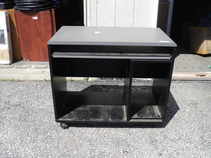lot 7979 image: Bush Office Furniture Desk 3 x 20 x 30, gray top, black bottom, damaged- pictured