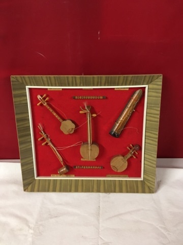 lot 3733 image: Framed Mounted Mini Guitars Display