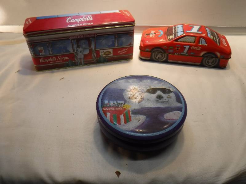 lot 4221 image: Coke race car tin, bear tin and dinner car tin All coca cola