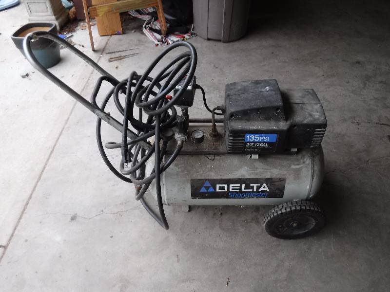 lot 4328 image: Delta 12 gallon air compressor