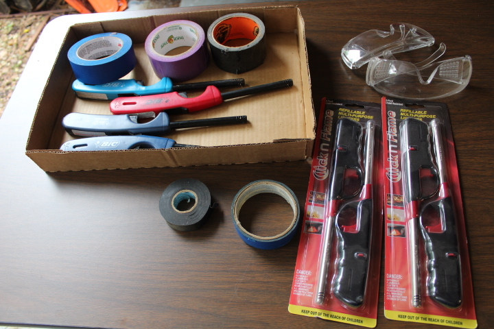 lot 5708 image: Lighters, Tape and Safety Glasses